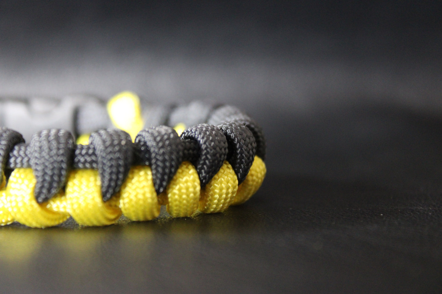 Yellow and black half-braided bracelet
