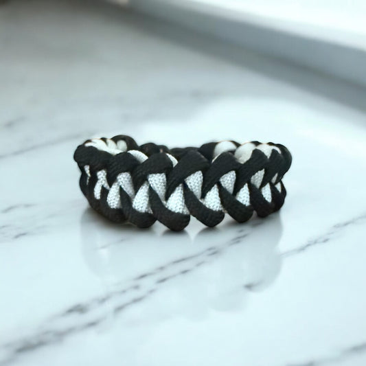 Black and white braided cross bracelet