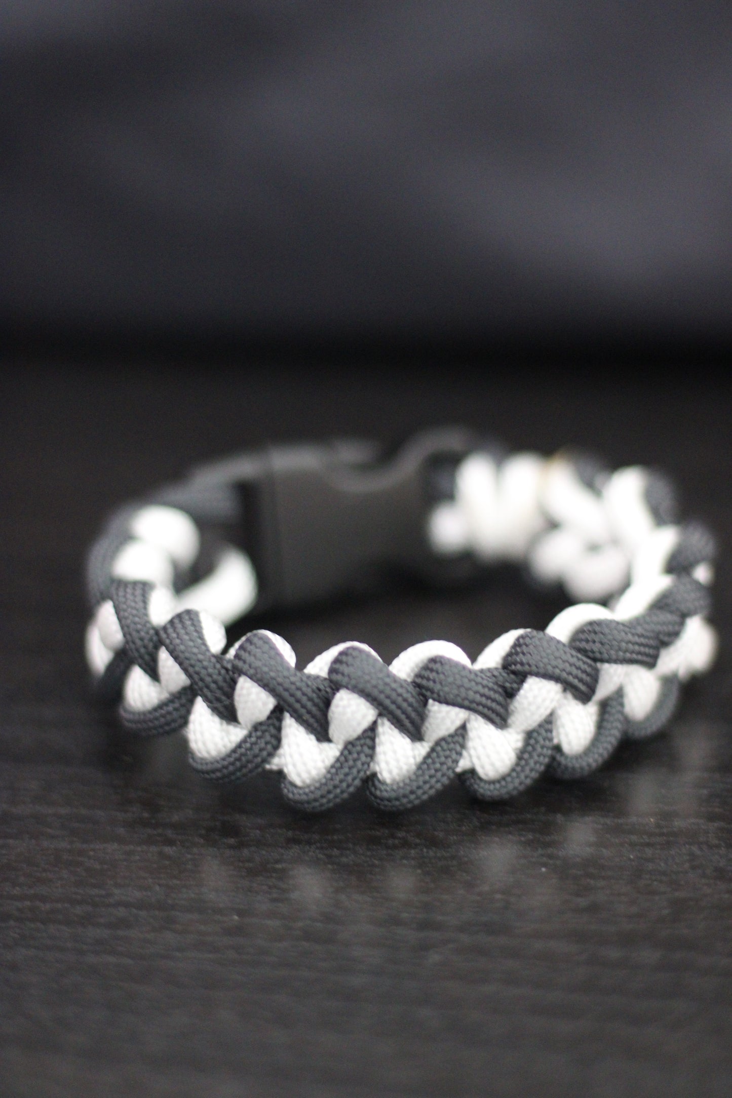 Anthracite and white braided cross bracelet