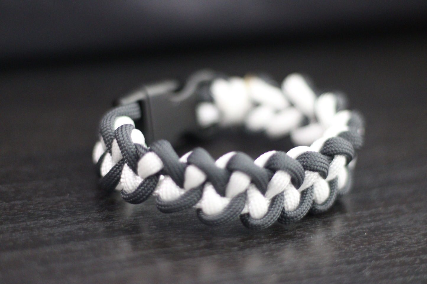Anthracite and white braided cross bracelet