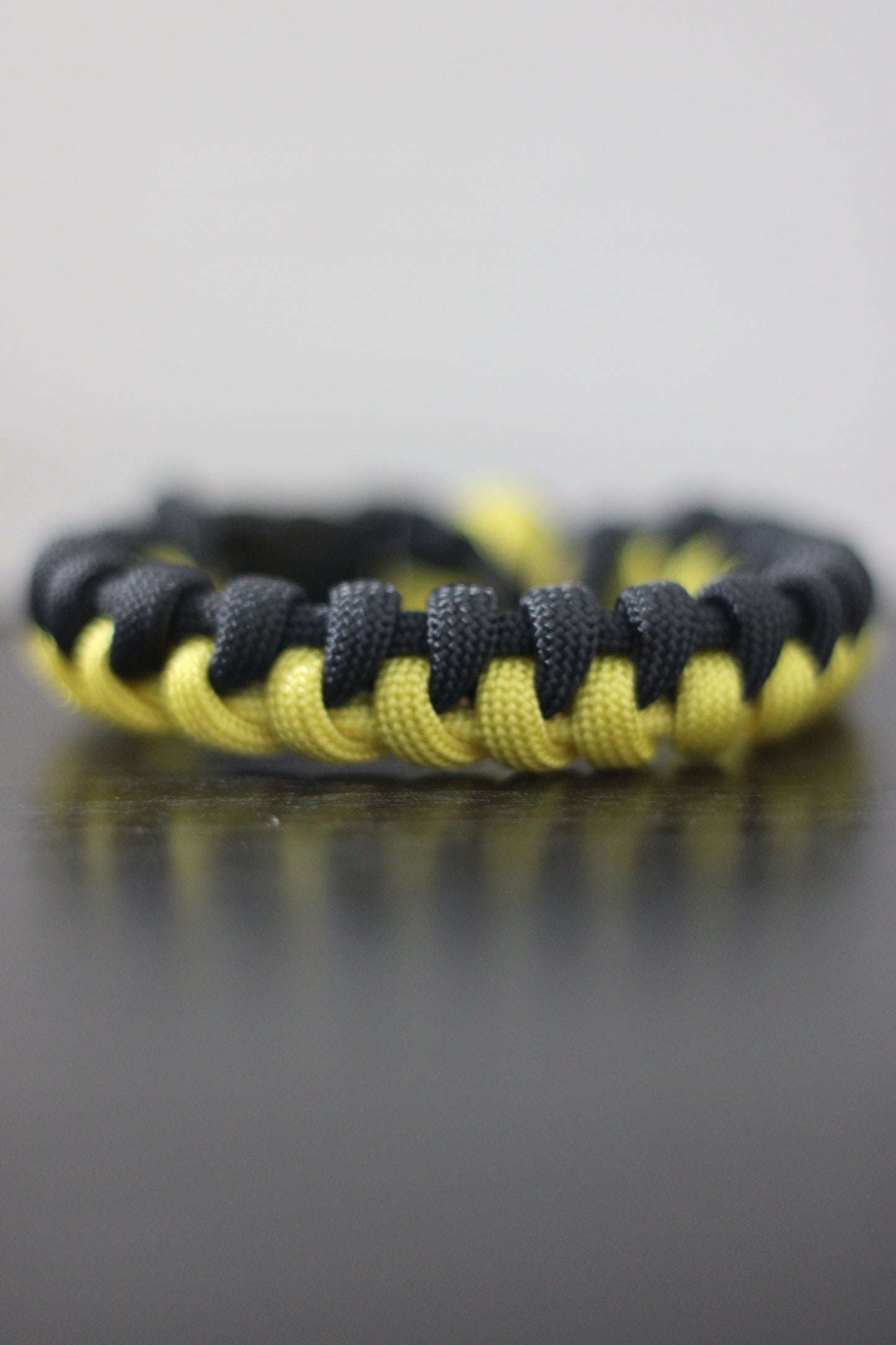 Yellow and black half-braided bracelet