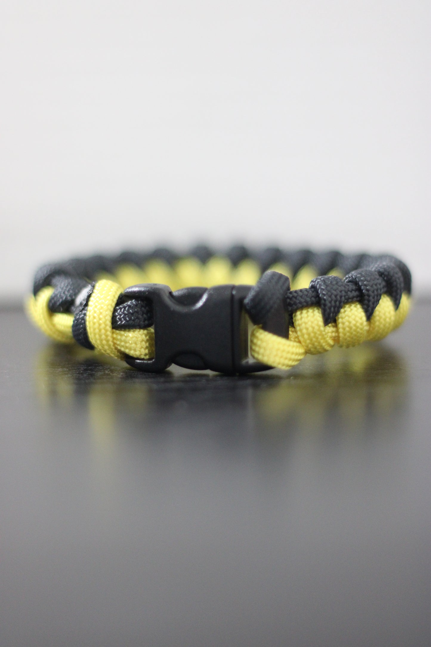 Yellow and black half-braided bracelet