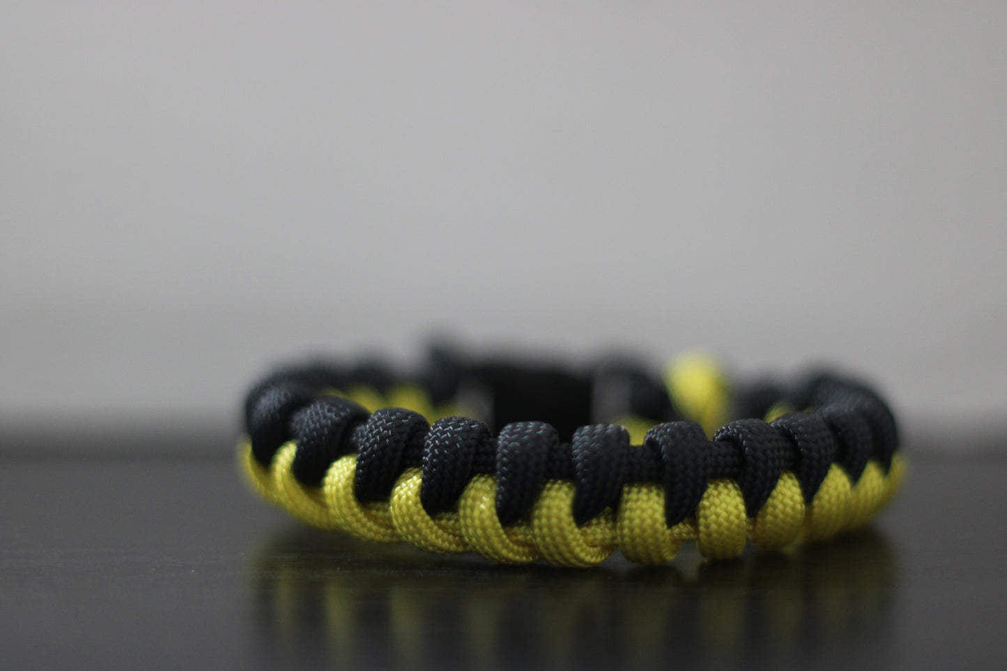 Yellow and black half-braided bracelet